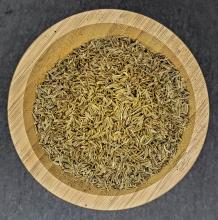 Cumin seeds whole displayed in wooden bowl